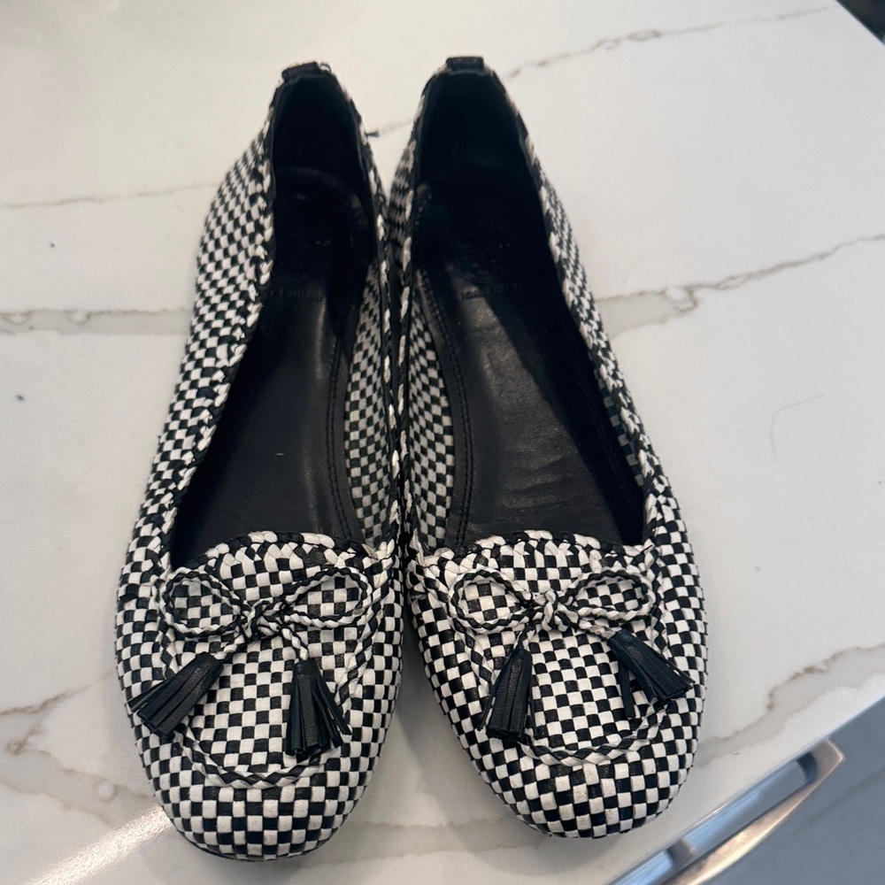 Super cute Tory Burch Black and White checkered loafer with the tassel bow